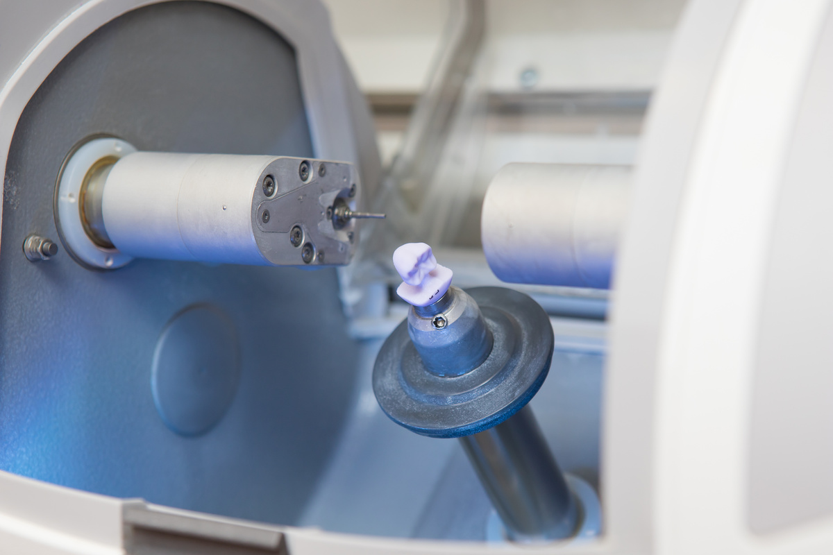 finished dental implant in the CEREC dental milling machine in the doctor's office