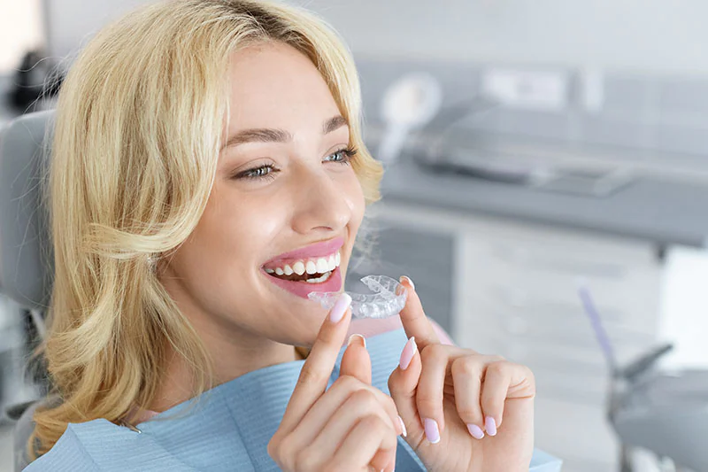 woman loving her Invisalign aligners from Roman Dental Arts